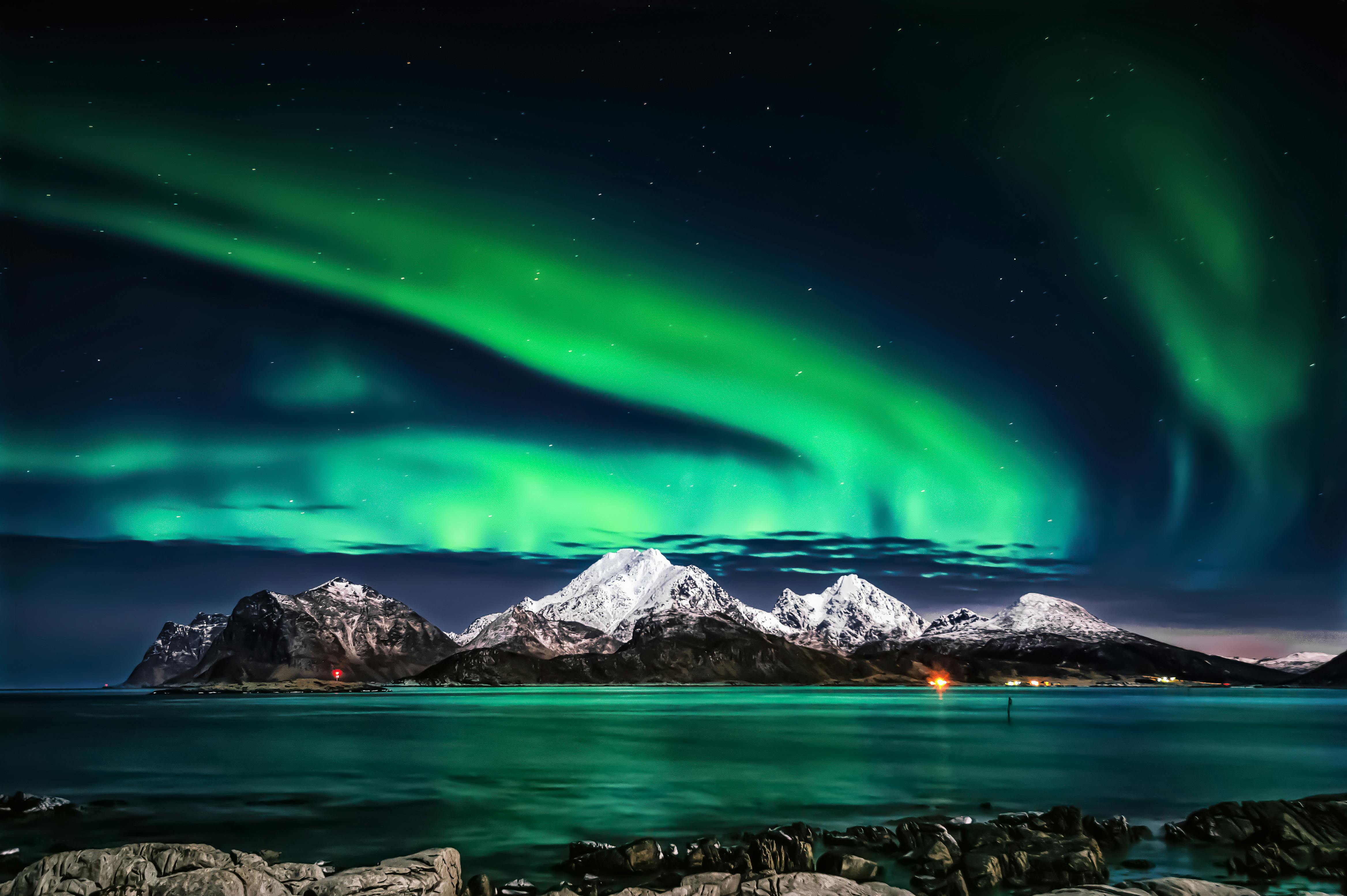 Image of the Northern Lights over a snowy Scandinavian landscape